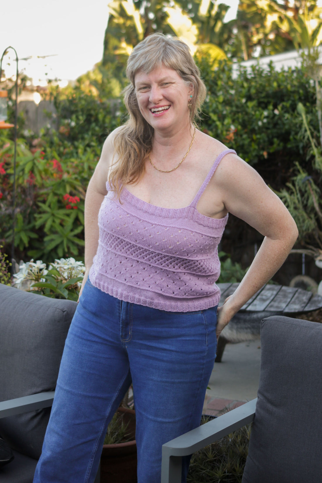 Heather Walpole wearing the lavender hand-knit Clear Skies Tank top made with Ewe Ewe Yarns Fluffy Fingering merino wool.