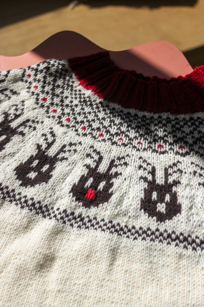 Reindeer Sweater, a Christmas colorwork yoke sweater knitting pattern in Ewe So Sporty