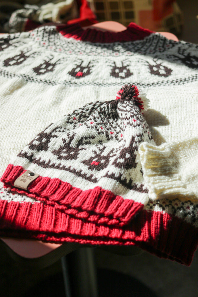 Reindeer Sweater, a Christmas colorwork yoke sweater knitting pattern in Ewe So Sporty