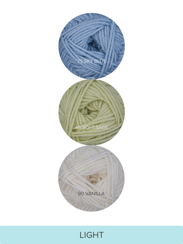 Color Theory Cowl yarn kit in the Light colorway: Sky Blue, Soft Sage, and Vanilla Ewe So Sporty merino yarn